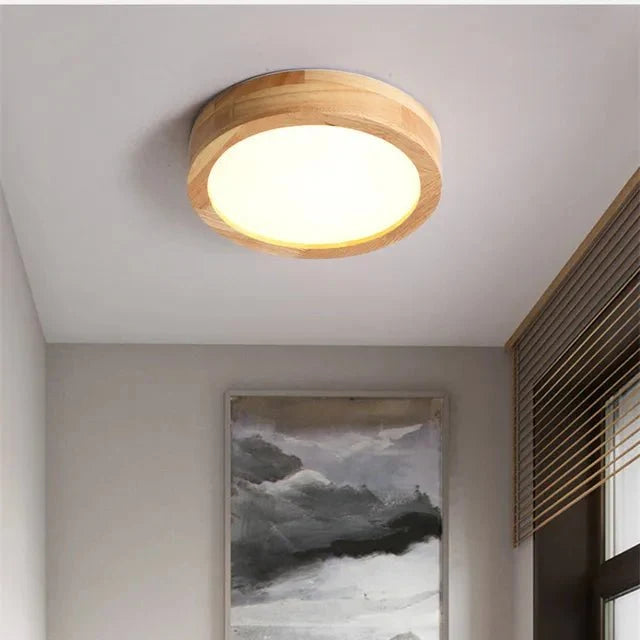Round solid-wood flush mount ceiling lamp with glowing LED light and wood ring