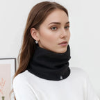 Black knit neck warmer scarf with plush lining, wrapped high at the neck