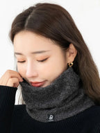 Dark gray plush-lined neck warmer scarf worn around the neck, close fit