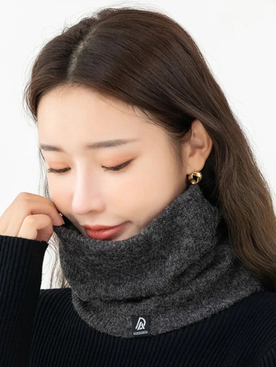 Dark gray plush-lined neck warmer scarf worn around the neck, close fit