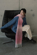 Gradient knit scarf in mauve and navy tones with long fringe ends