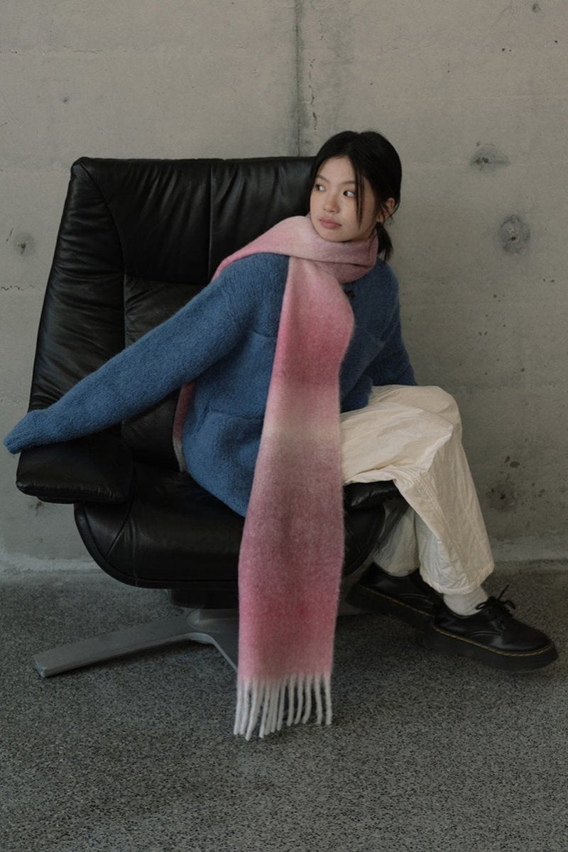 Gradient knit scarf in mauve and navy tones with long fringe ends