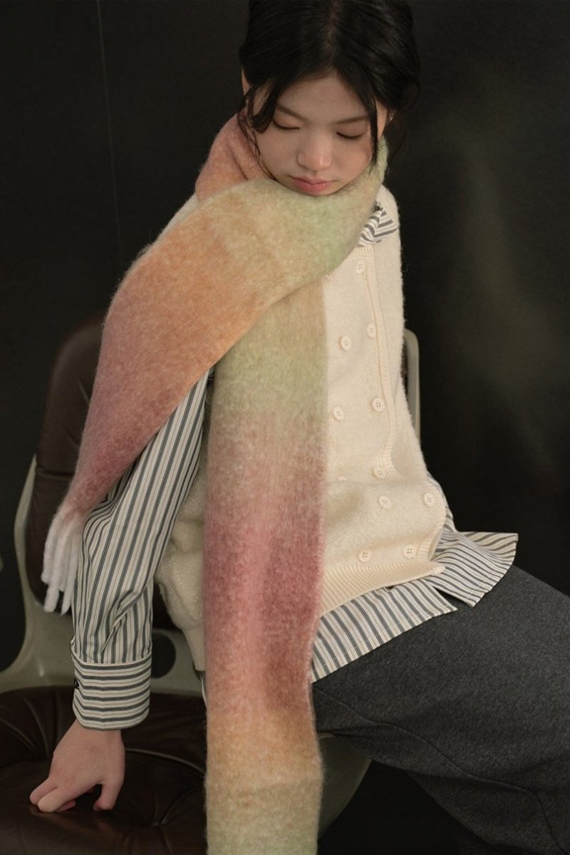 Long knit gradient scarf in peach, pink, and pale green with fringed ends