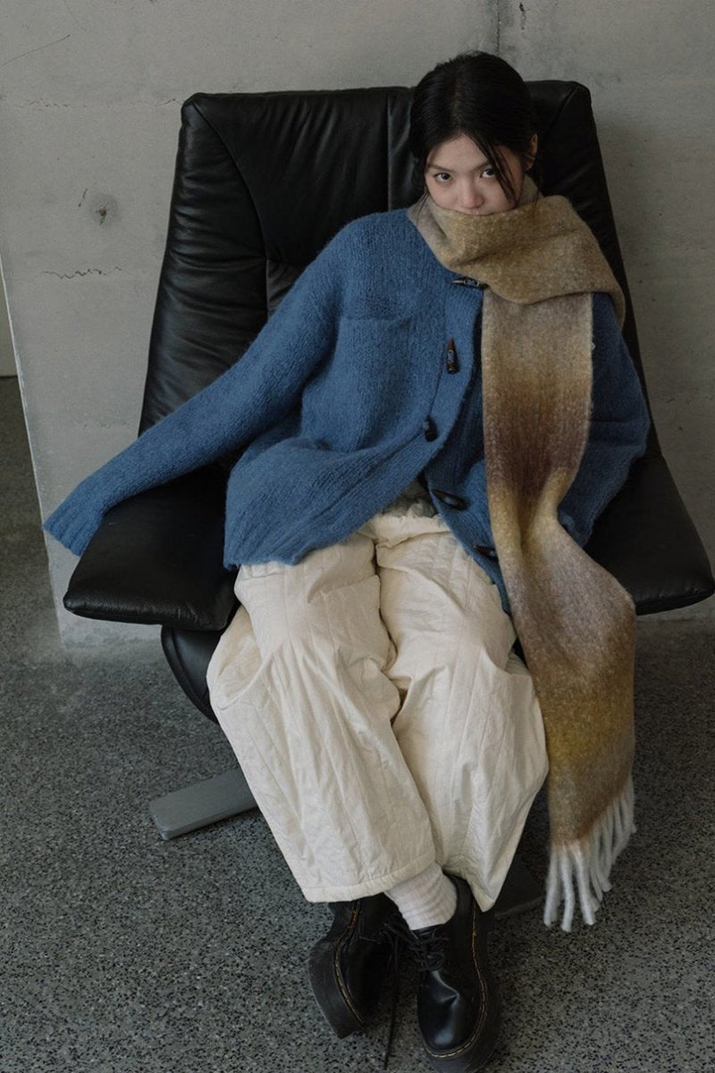 Blue to tan gradient knit scarf with long fringed ends for a cozy wrap