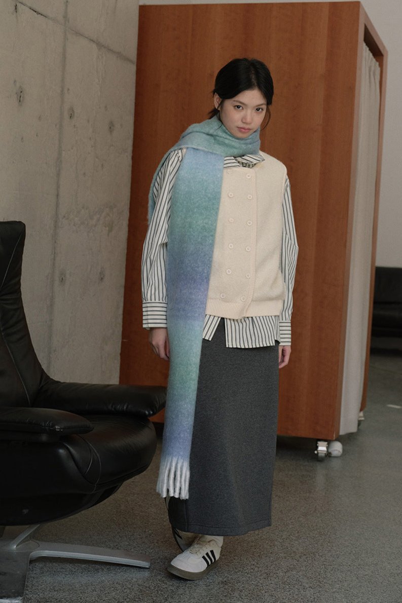 Blue gradient knit scarf wrap with striped edging and long fringed ends