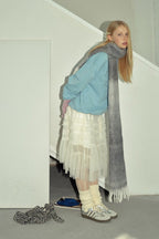 Gray to charcoal gradient knit scarf wrap with long fringed ends and cozy drape