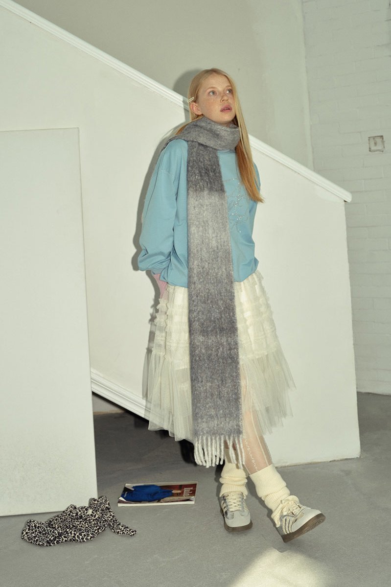 Gray to charcoal gradient knit scarf wrap with long fringed ends and soft knit