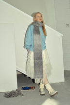Gray to charcoal gradient knit scarf wrap with long fringed ends and soft knit