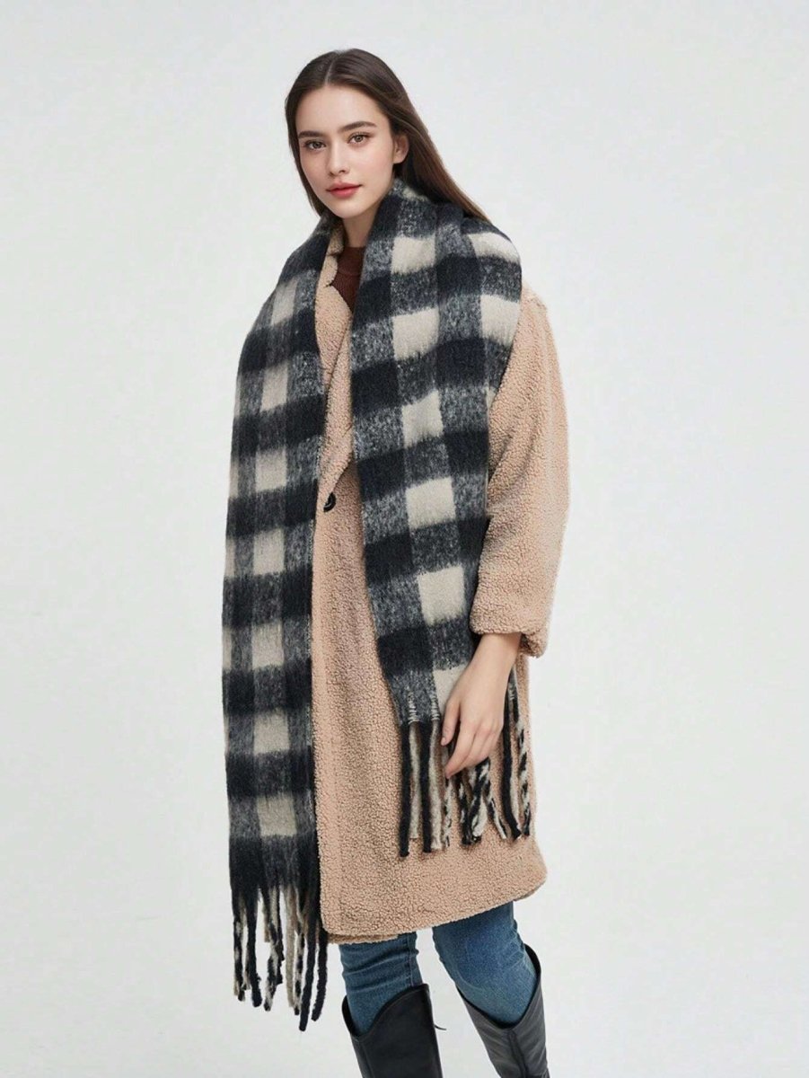 Black and white plaid cashmere scarf with long fringes, worn on the neck