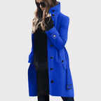 Women’s blue button-front long coat with high stand collar, flap pockets, belt strap