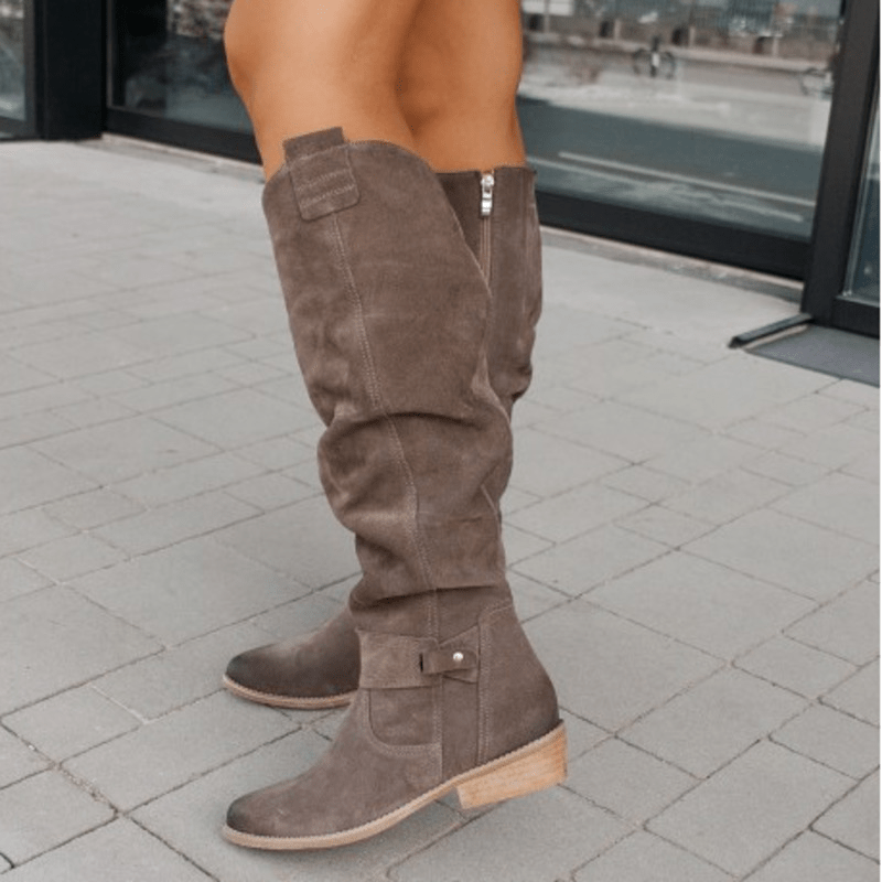 Mocha brown knee-high slouch boots with low block heel and side strap detail