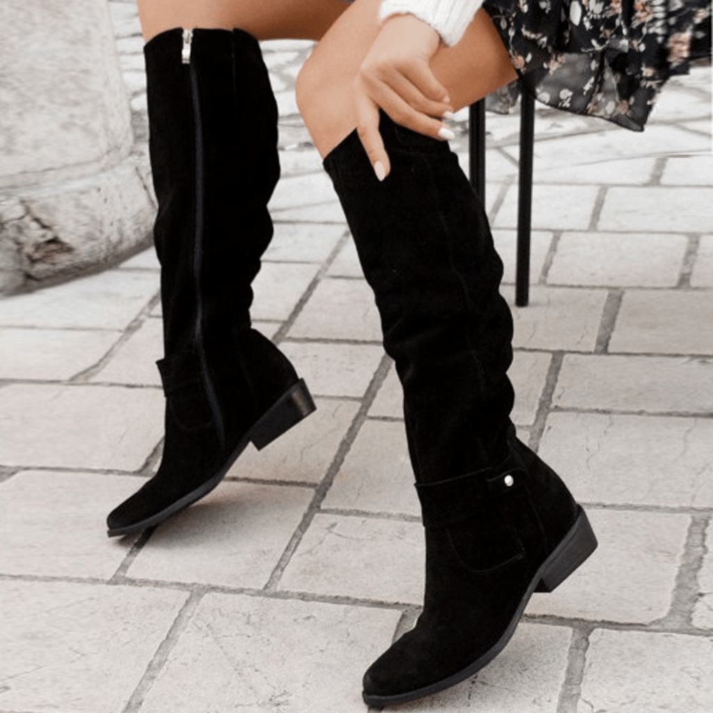 Black knee-high slouch boots with low block heel and side pull-on fit