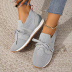Women's lightweight slip-on sneakers, light grey knit with lace-up bow and white sole