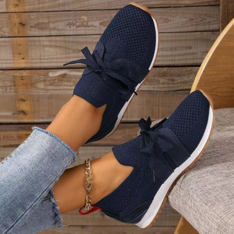 Women's lightweight slip-on sneakers, navy knit with lace-up bow and white outsole