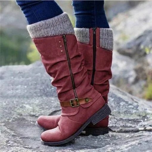 Women’s red winter boots with knit cuff, side zipper, and buckle strap