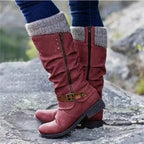 Women’s red winter boots with knit cuff, side zipper, and buckle strap