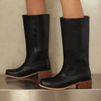 Black knee-high riding boots with pull-on shaft and low stacked heel