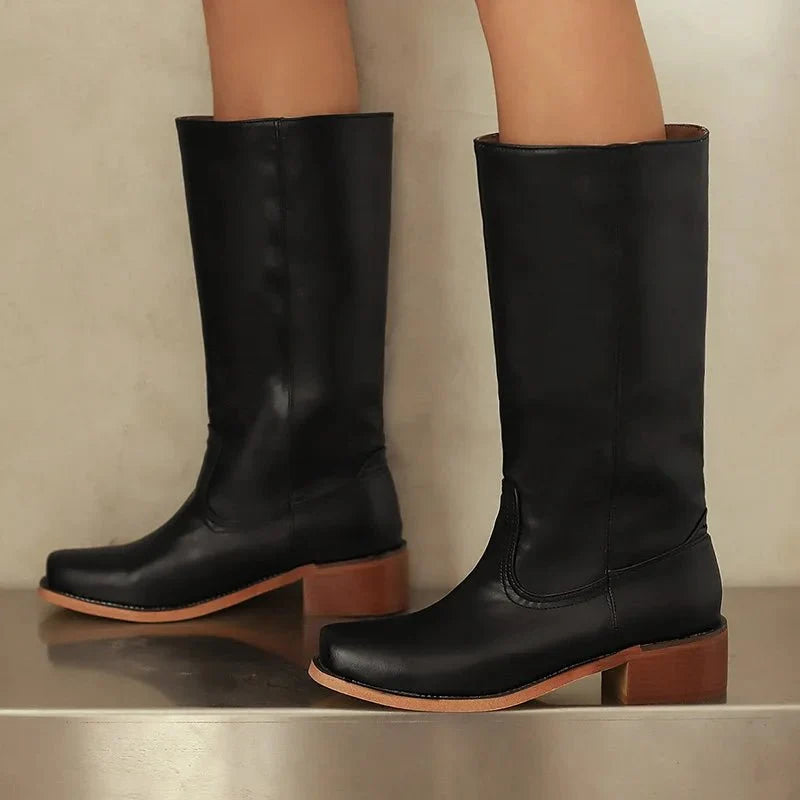 Black knee-high riding boots with pull-on shaft and low stacked heel