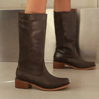 Dark brown knee-high riding boots with square toe and low stacked heel