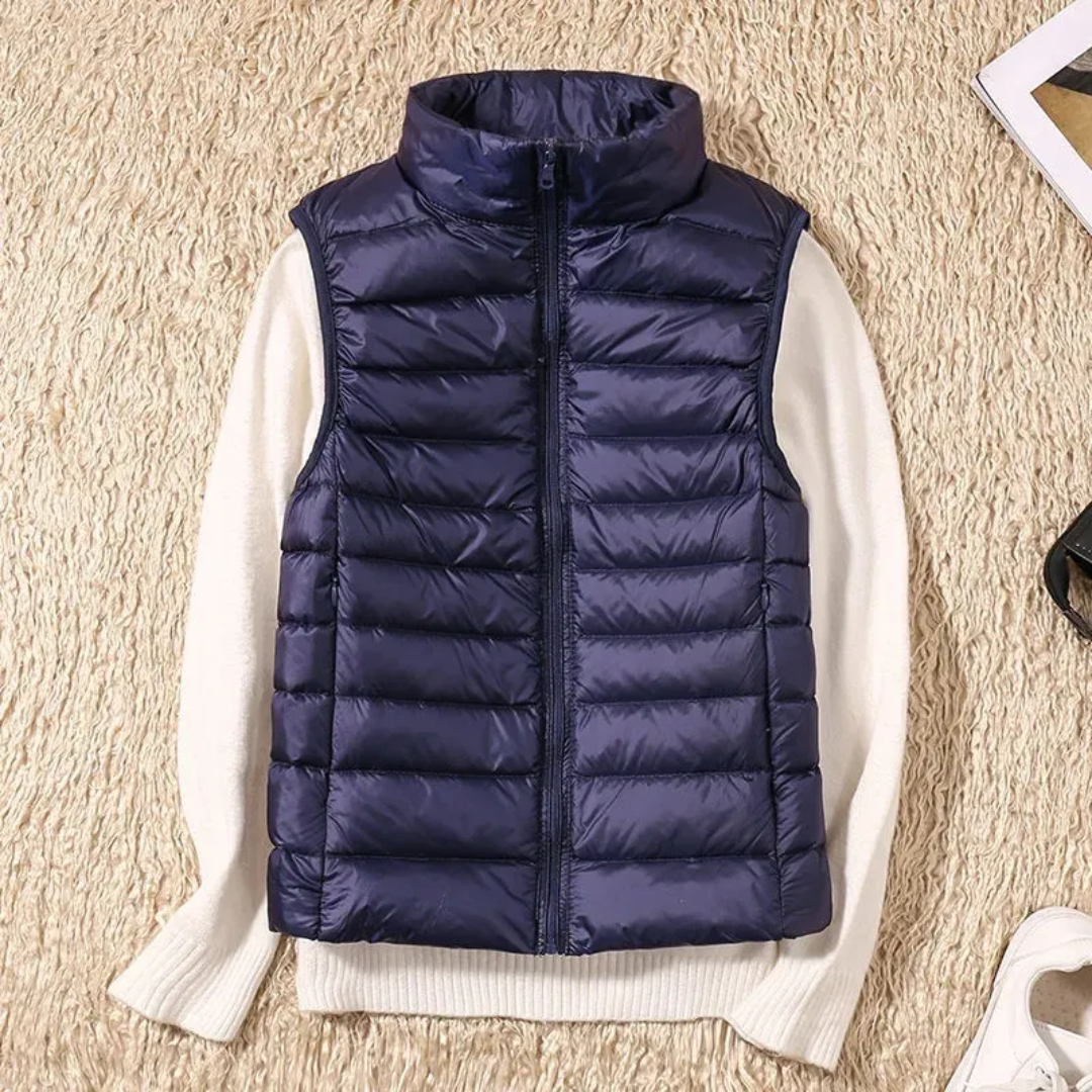 Ultralight quilted bodywarmer in navy, sleeveless, full-zip with stand collar