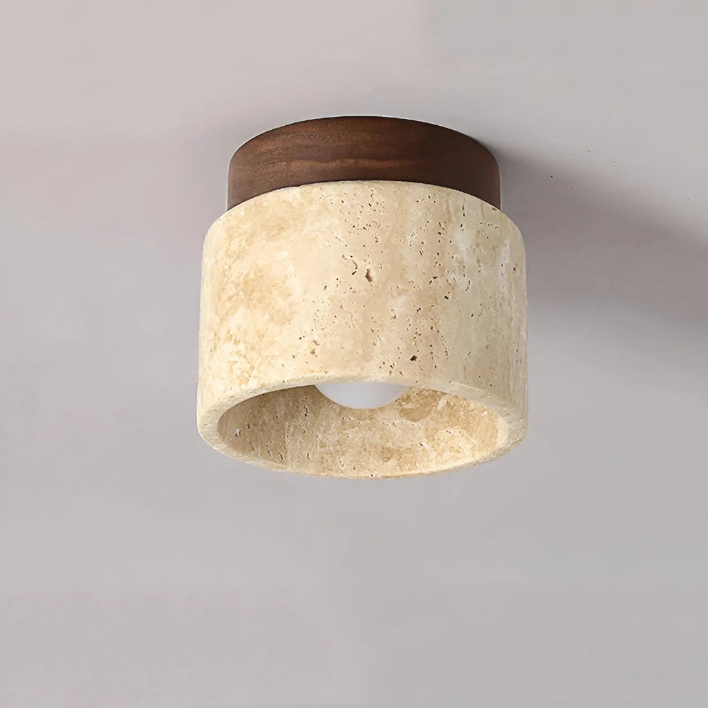 Ceiling flush mount lamp with textured travertine cylinder shade and dark walnut top.