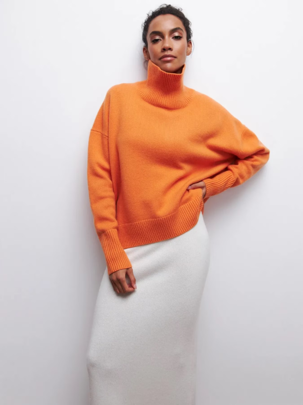 Orange knitted turtleneck sweater with long sleeves and ribbed hem and cuffs