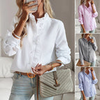 White long-sleeve ruffle button-up blouse with front buttons and ruffled collar