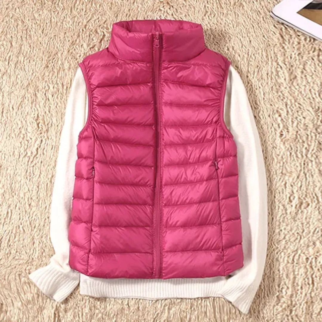 Ultralight quilted bodywarmer in bright pink, sleeveless, full-zip with stand collar
