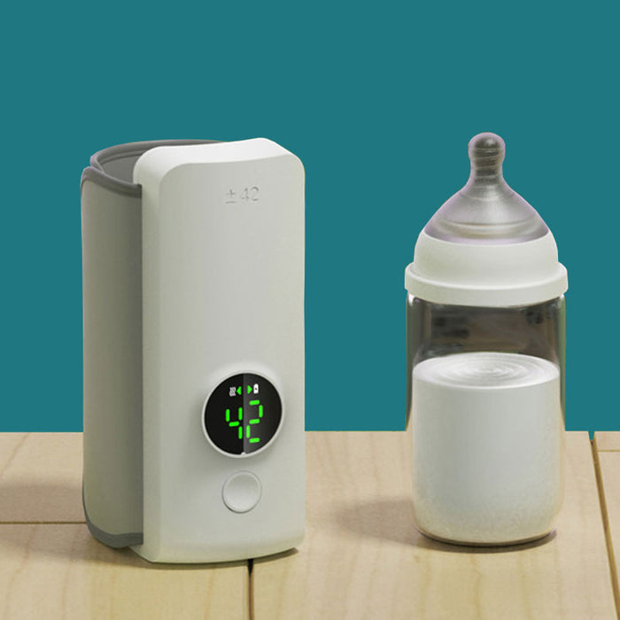 Rechargeable portable bottle warmer with green LED display and baby bottle on table
