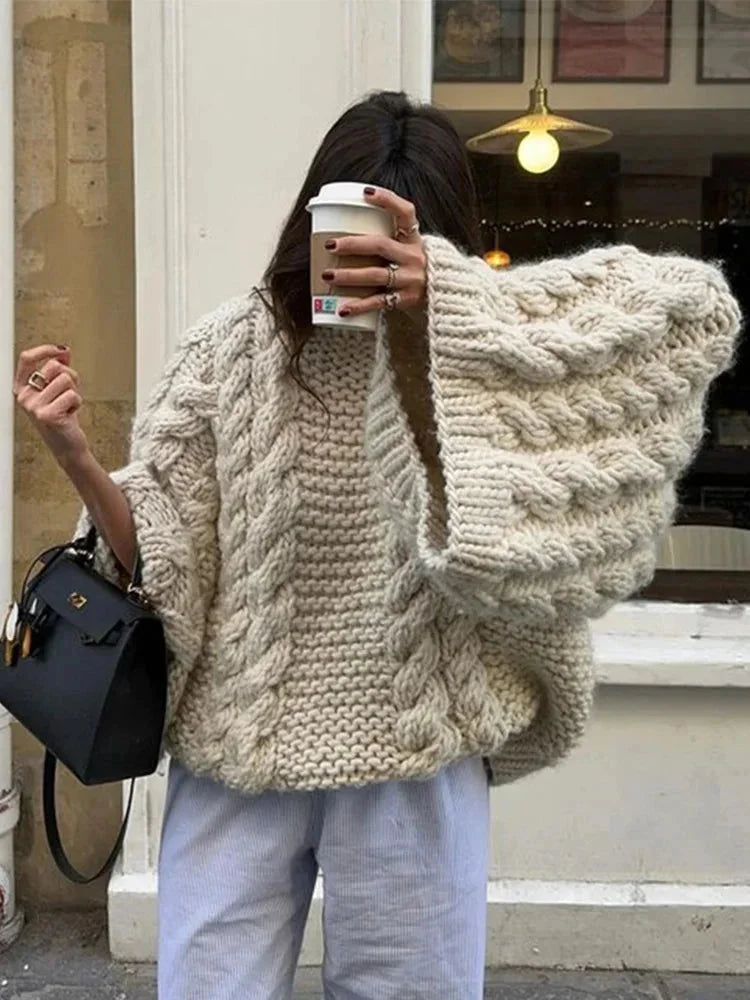 Cream chunky knit cocoon sweater with wide sleeves and cable knit V-neck