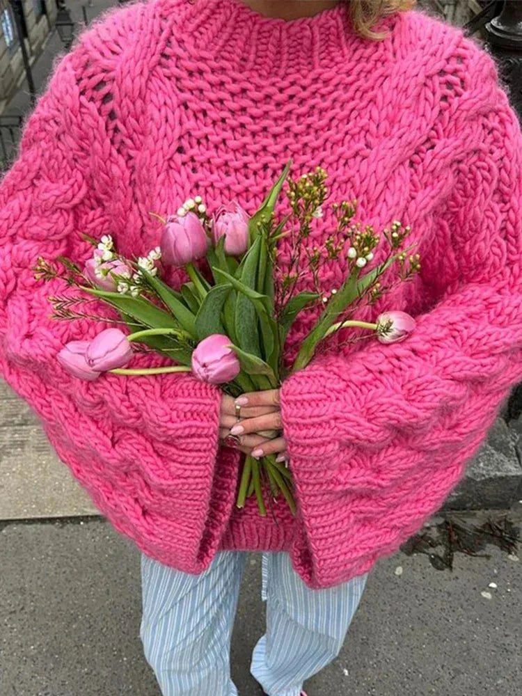 Pink chunky knit cocoon sweater with wide sleeves and ribbed texture