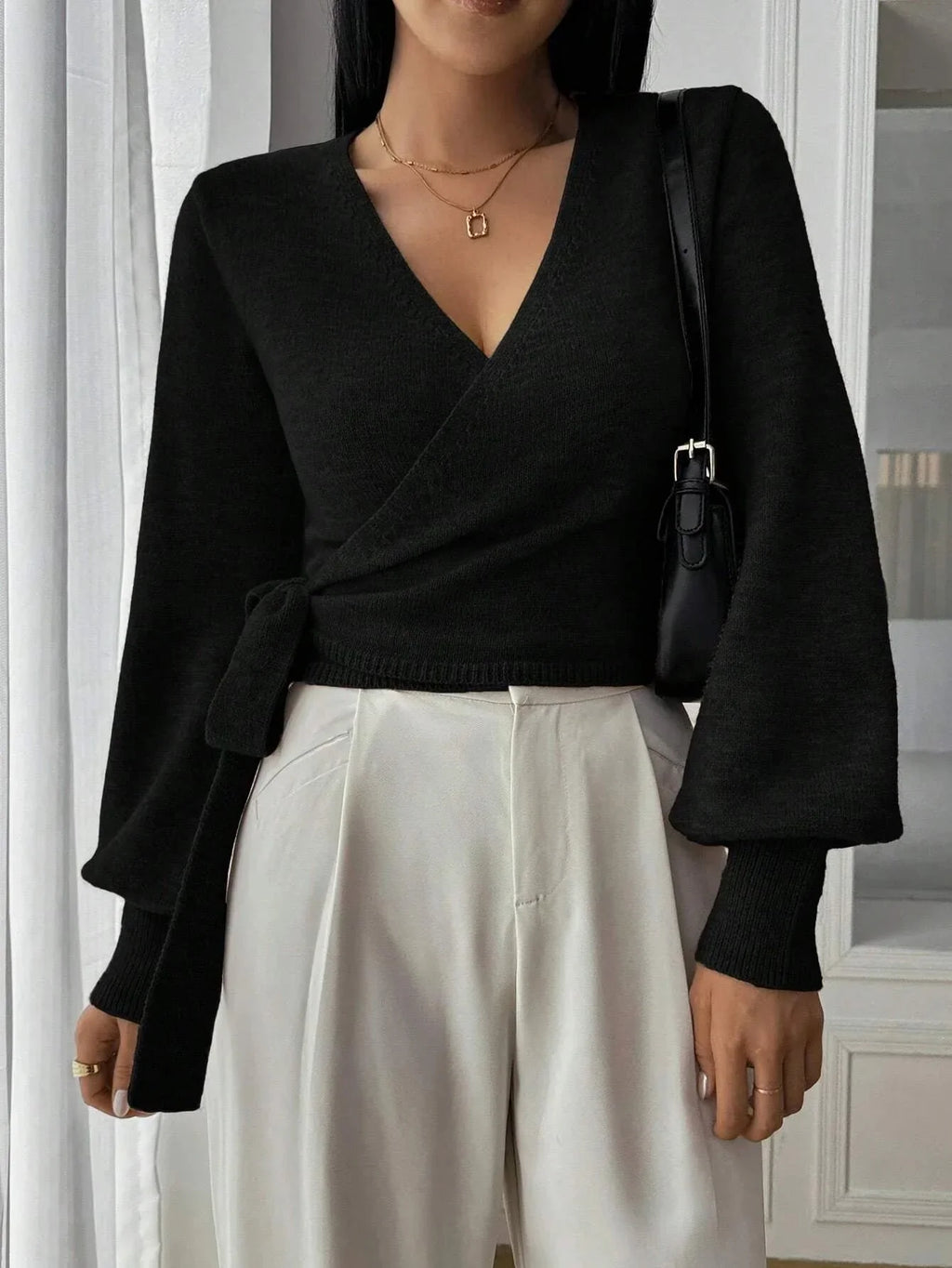 Women’s wrap sweater (black) with tie belt, V-neck and long sleeves; ribbed hem
