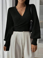 Women’s wrap sweater (black) with tie belt, V-neck and long sleeves; ribbed hem