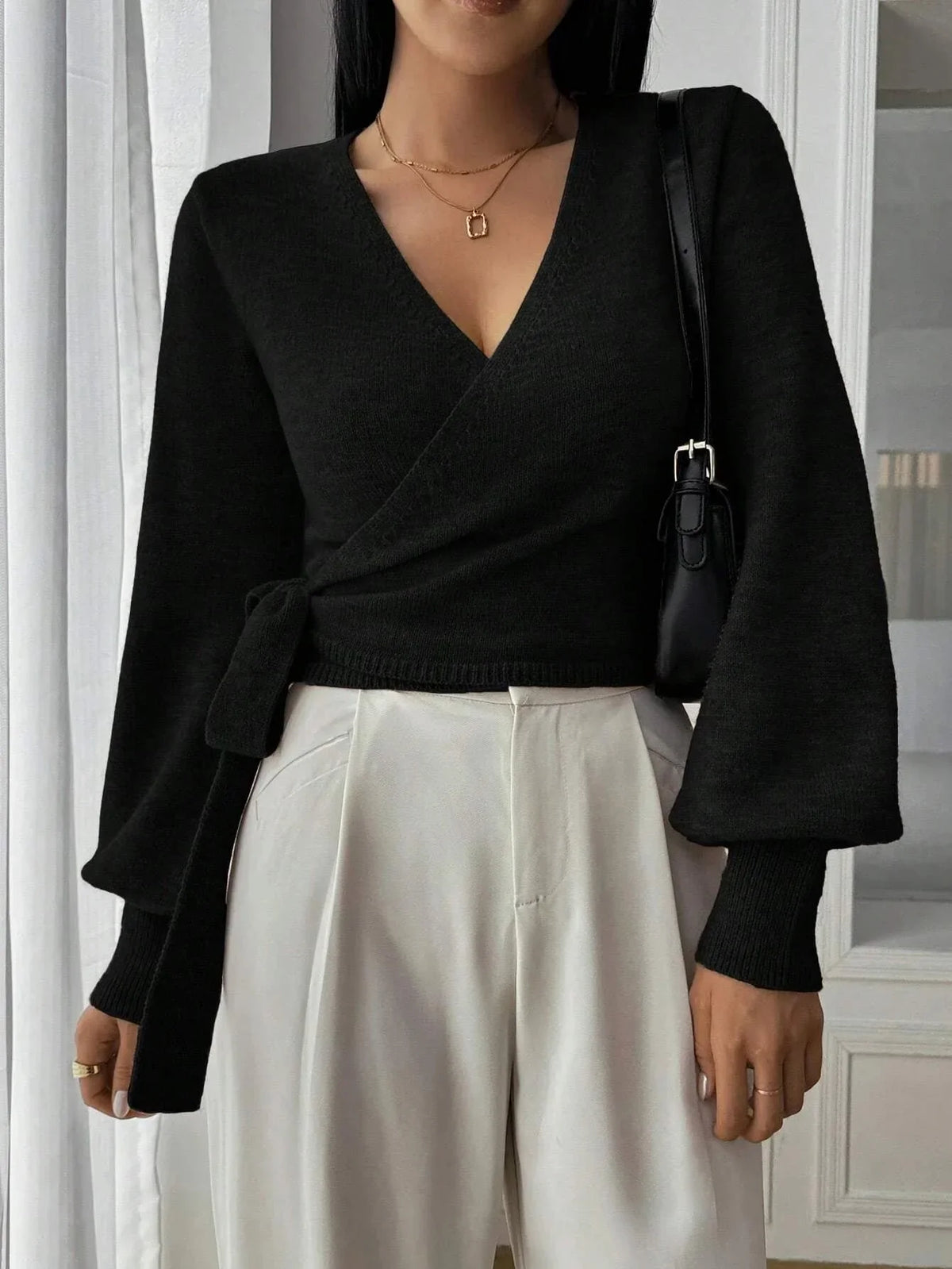 Women’s wrap sweater (black) with tie belt, V-neck and long sleeves; ribbed hem