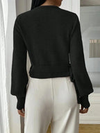 Women’s wrap sweater (black) with tie belt; V-back neckline and ribbed cuffs