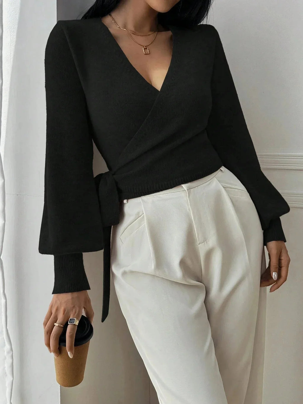 Women’s wrap sweater (black) with tie belt and V-neck; long sleeves with ribbed cuffs