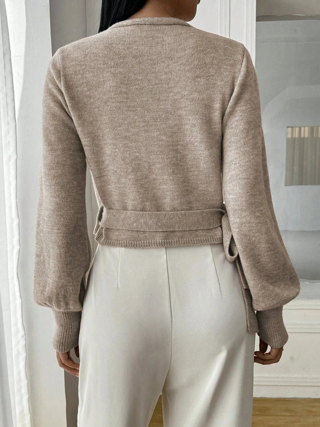 Women’s wrap sweater (light brown) with tie belt, long sleeves; ribbed cuffs