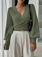 Women’s wrap sweater (green) with tie belt, V-neck and long sleeves; ribbed hem