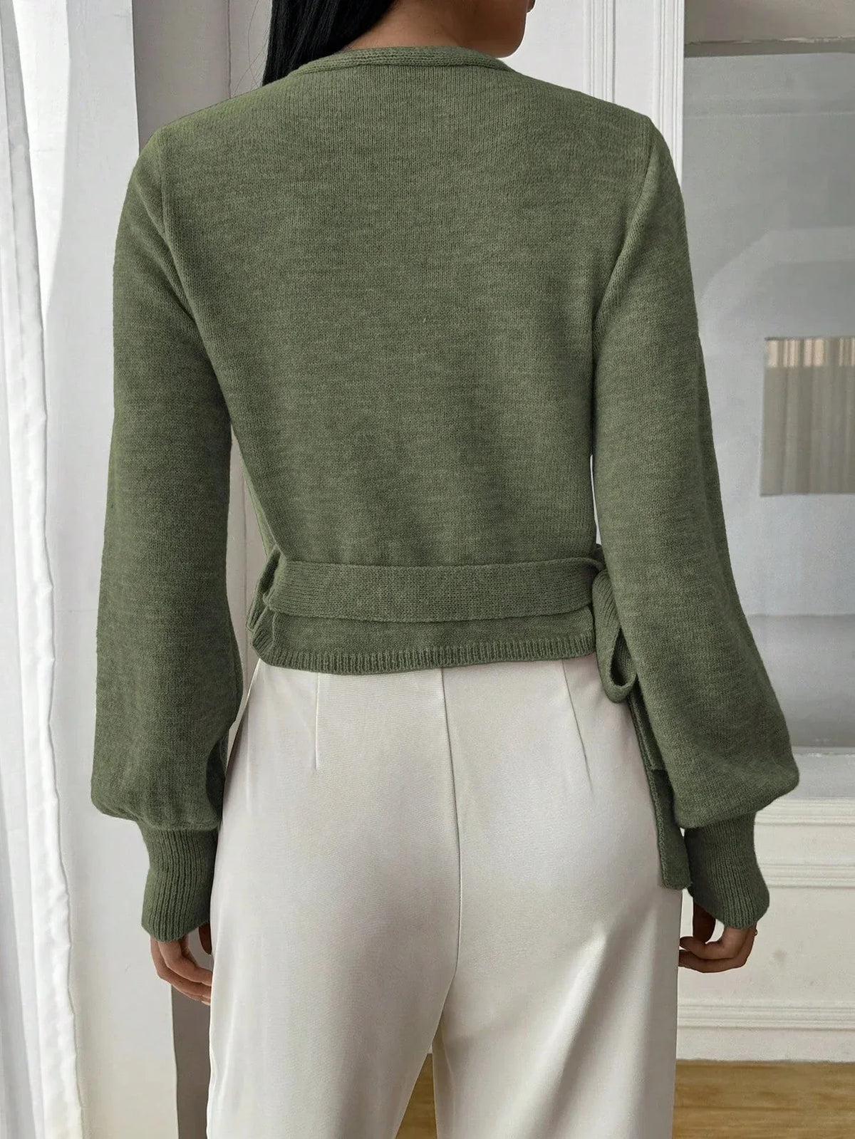 Women’s wrap sweater (green) with tie belt; long sleeves and ribbed cuffs