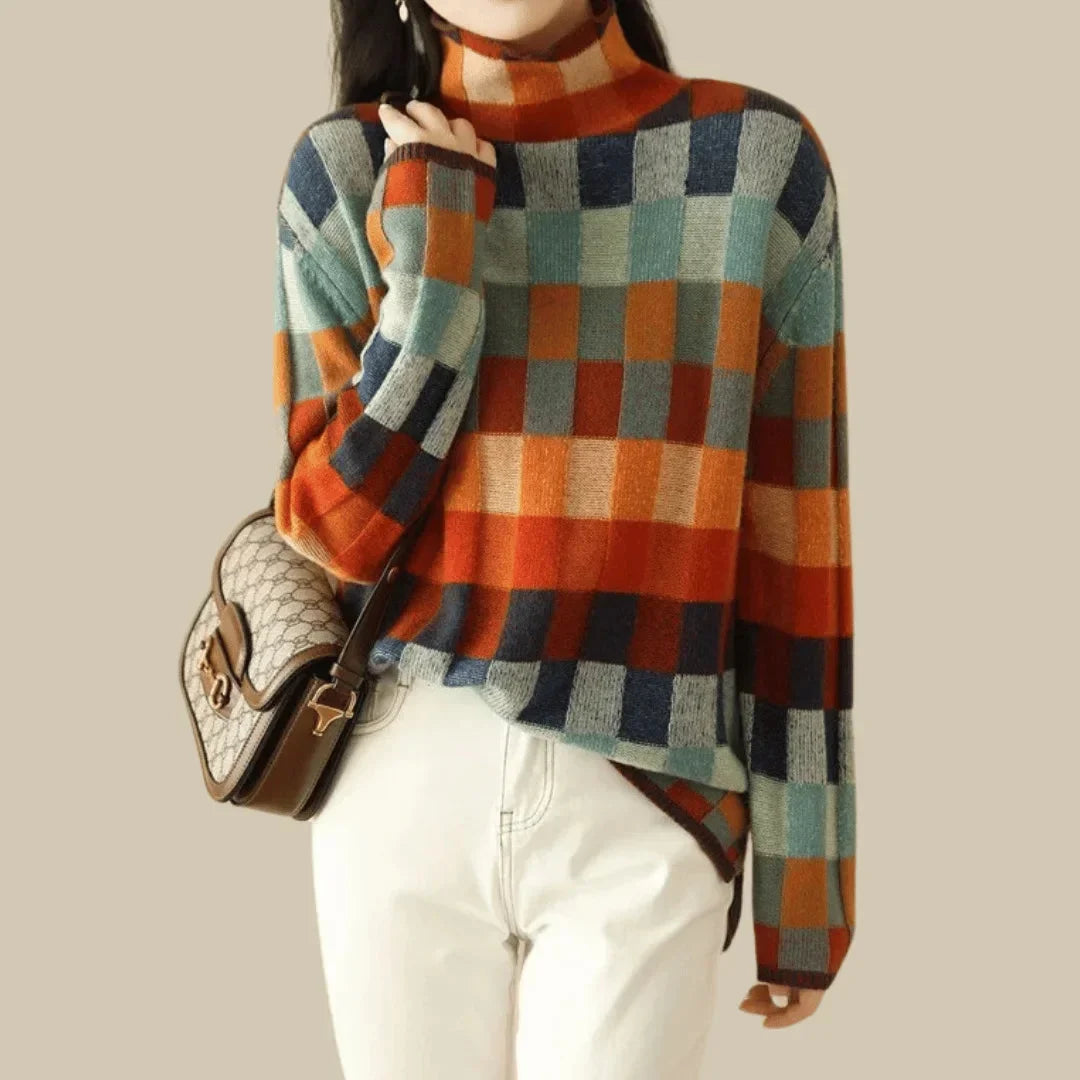 Women’s multicolored patchwork turtleneck sweater with checked plaid pattern and long sleeves