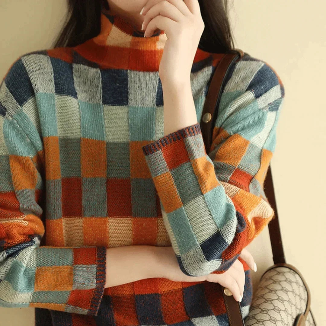 Women’s multicolored patchwork turtleneck sweater with long sleeves and plaid blocks