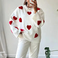 White heart-pattern sweater with red hearts, ribbed cuffs and crewneck