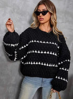 Textured knit sweater, black with white stripe pattern across chest and sleeves