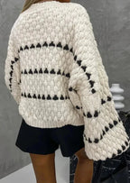 Textured knit sweater back view, cream with black stripe rows