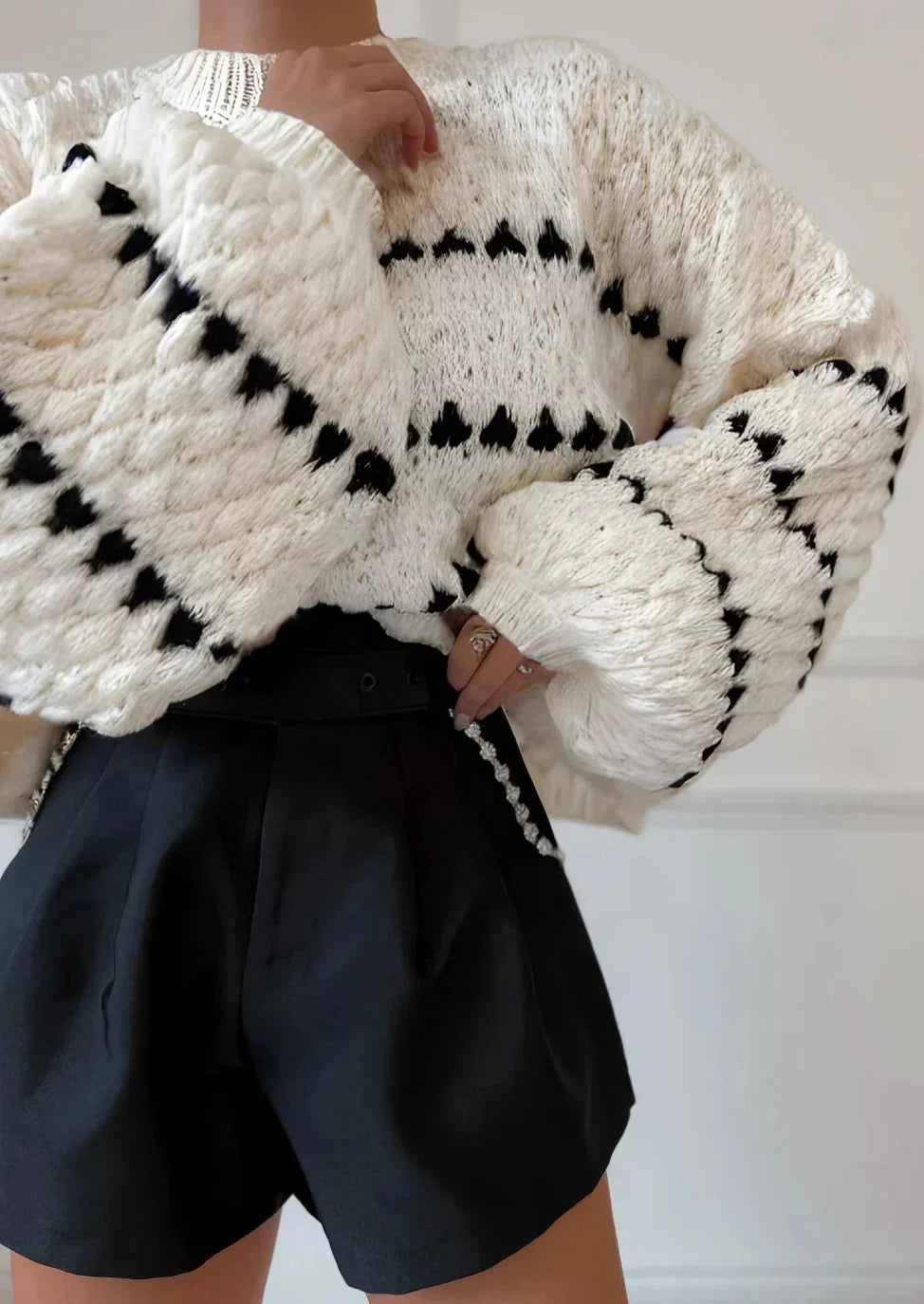 Textured knit sweater, cream with black diamond-and-stripe pattern, chunky cuffs