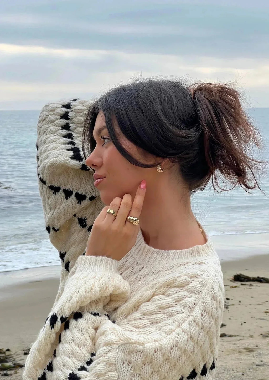 Textured knit sweater, cream with black geometric stripes on sleeves