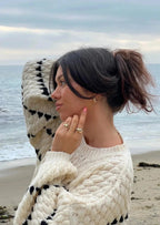 Textured knit sweater, cream with black geometric stripes on sleeves