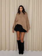 Toffee-brown loose turtleneck sweater with long sleeves and relaxed fit