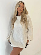Vanilla turtleneck sweater with textured knit and oversized, loose fit
