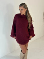 Burgundy loose knit turtleneck sweater with wide sleeves and soft texture